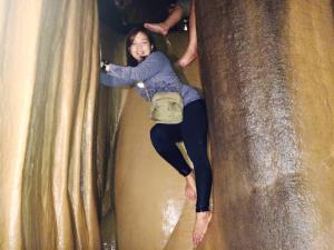 Crisel! The first one to go down to this very slippery  stalactite rock formation to reach the second stage of Spelunking! Look at her pose!